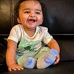 Face, Nose, Cheek, Skin, Smile, Hand, Arm, Mouth, Baby & Toddler Clothing, Flash Photography, Sleeve, Gesture, Happy, Finger, Toddler, Baby, Comfort, T-shirt, Child, Fun, Person