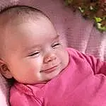 Nose, Cheek, Skin, Smile, Lip, Eyebrow, Eyes, Ear, Iris, Baby & Toddler Clothing, Happy, Pink, Baby, Toddler, Eyelash, Grass, Comfort, Magenta, Plant, Fun, Person