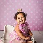Skin, Smile, Purple, Dress, Happy, Pink, Flash Photography, Baby & Toddler Clothing, Toddler, Thigh, Baby, Child, Sock, Magenta, Event, Headpiece, Pattern, Embellishment, Jewellery, Sitting, Person, Joy