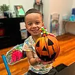 Smile, Facial Expression, Orange, Happy, Leisure, Toddler, Fun, Wood, Ball, Shorts, Child, Sports Toy, Event, T-shirt, Hardwood, Picture Frame, Room, Play, Baby, Person, Joy