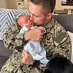Military Camouflage, Camouflage, Dog, Military Uniform, Military Person, Cargo Pants, Marines, Gesture, Baby, Soldier, Interaction, Army, Carnivore, Non-commissioned Officer, People, Military Organization, Comfort, Toddler, Military Officer, Child, Person