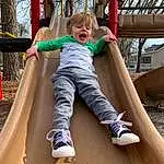 Leg, Playground, Smile, Comfort, Toddler, Leisure, Playground Slide, Plant, Tree, Wood, Recreation, Chute, Fun, Outdoor Play Equipment, City, Child, Sitting, Play, Symmetry, Sky, Person
