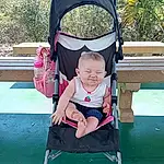 Wheel, Tire, Baby Carriage, Toddler, Leisure, Grass, Fun, Baby & Toddler Clothing, Plant, Tree, Baby, Smile, Baby Products, Travel, Sitting, Sky, Child, Comfort, Recreation, Vacation, Person, Joy