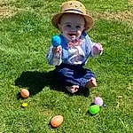 Plant, Leg, People In Nature, Leaf, Hat, Sun Hat, Ball, Grass, Baby, Toddler, Summer, Recreation, Groundcover, Leisure, Toy, Fun, Lawn, Grassland, Sports Equipment, Person, Joy