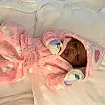 Skin, Arm, Comfort, Baby, Pink, Gesture, Toddler, Child, Linens, Thumb, Nail, Health Care, Baby & Toddler Clothing, Baby Products, Room, Peach, Medical Procedure, Bedtime, Childbirth, Baby Sleeping, Person, Headwear
