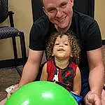 Face, Smile, Happy, Balloon, Party Supply, Toddler, Fun, T-shirt, Event, Leisure, Child, Recreation, Chair, Shorts, Party, Play, Toy, Holiday, Person, Joy