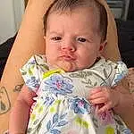 Nose, Face, Cheek, Skin, Lip, Chin, Hairstyle, Arm, Eyebrow, Eyes, Mouth, Facial Expression, Baby, Neck, Textile, Comfort, Baby & Toddler Clothing, Sleeve, Iris, Person