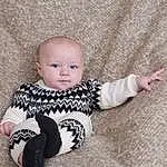 Cheek, Skin, Head, Arm, Eyes, Baby & Toddler Clothing, Sleeve, Wood, Baby, Toddler, Pattern, Comfort, Sitting, Wool, Child, Baby Toys, Baby Products, Art, Person