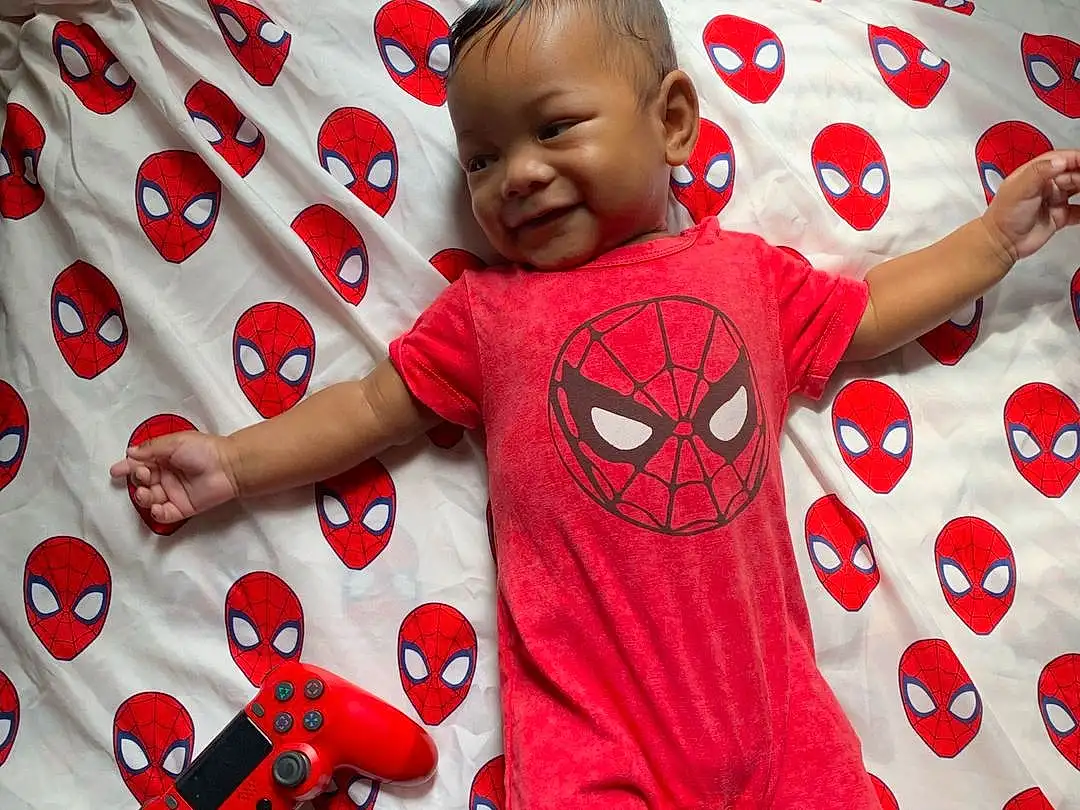 Smile, Shirt, Facial Expression, Baby & Toddler Clothing, Sleeve, Happy, Baby, T-shirt, Red, Toddler, Cool, Child, Pattern, Linens, Carmine, Comfort, Baby Toys, Play, Fictional Character, Pajamas, Person
