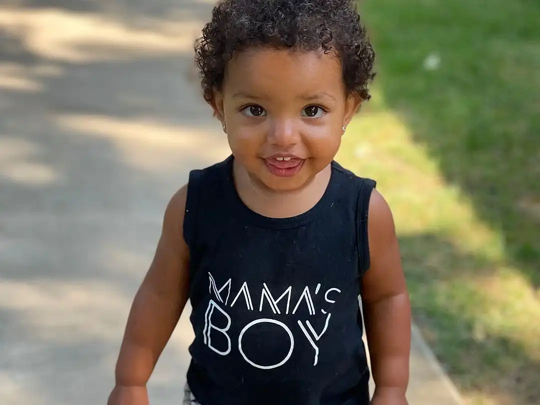 Face, Joint, Skin, Head, Smile, Arm, Eyes, Shorts, Neck, Sleeve, Standing, Flash Photography, Happy, Baby & Toddler Clothing, Cool, Summer, Toddler, Grass, Fun, T-shirt, Person