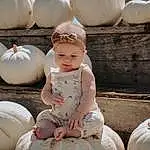 Photograph, White, Pumpkin, Plant, Calabaza, Headgear, Happy, Cucurbita, People, Winter Squash, Gourd, Wood, Toy, Event, Natural Foods, Art, Baby & Toddler Clothing, Squash, Sitting, Person, Headwear