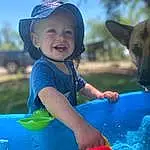 Smile, Photograph, Water, Blue, Green, Azure, Sky, Happy, Fun, Leisure, Toddler, Fawn, Hat, Grass, People, Summer, Recreation, Person, Headwear