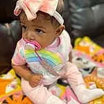 Cheek, Skin, Baby, Pink, Baby & Toddler Clothing, Toddler, Fun, Happy, Child, Baby Products, Sitting, Baby Playing With Toys, Recreation, Hat, Play, Comfort, Toy, Person, Headwear