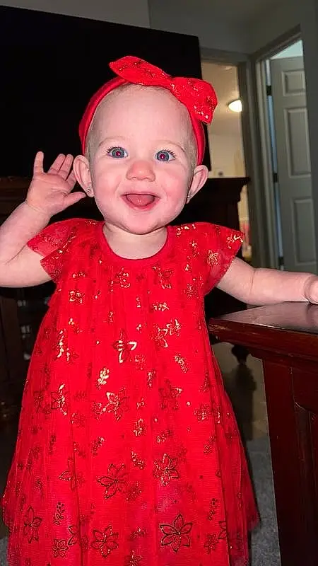 Smile, Facial Expression, Dress, Baby & Toddler Clothing, Fashion, Textile, Sleeve, Standing, Pink, One-piece Garment, Cabinetry, Happy, Toddler, Baby, Red, Magenta, Child, Day Dress, Fun, Event, Person, Joy