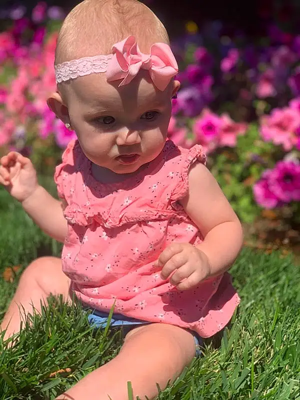Face, Skin, Head, Lip, Plant, Eyes, Leg, Mouth, Leaf, Human Body, People In Nature, Happy, Petal, Baby & Toddler Clothing, Pink, Toddler, Grass, Red, Baby, Person, Headwear