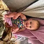 Skin, Hand, Comfort, Leg, Human Body, Textile, Baby, Pink, Finger, Fawn, Headgear, Wood, Baby & Toddler Clothing, Toddler, Linens, People, Toy, Beauty, Pattern, Person, Joy