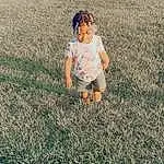 Head, Leg, People In Nature, Plant, Happy, Grass, Toddler, Grassland, T-shirt, Landscape, Meadow, Tints And Shades, Lawn, Baby, Ball, Field, Human Leg, Child, Prairie, Person