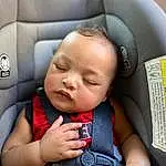 Nose, Cheek, Skin, Photograph, Comfort, Gesture, Automotive Design, Baby, Toddler, Baby & Toddler Clothing, Happy, Child, Car Seat, Auto Part, Head Restraint, Vroom Vroom, Thumb, Baby Products, Vehicle Door, Person
