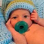 Face, Nose, Cheek, Skin, Head, Hand, Eyes, Blue, Baby, Azure, Cap, Human Body, Textile, Finger, Toddler, Baby & Toddler Clothing, Child, Baby Products, Linens, Close-up, Person, Headwear