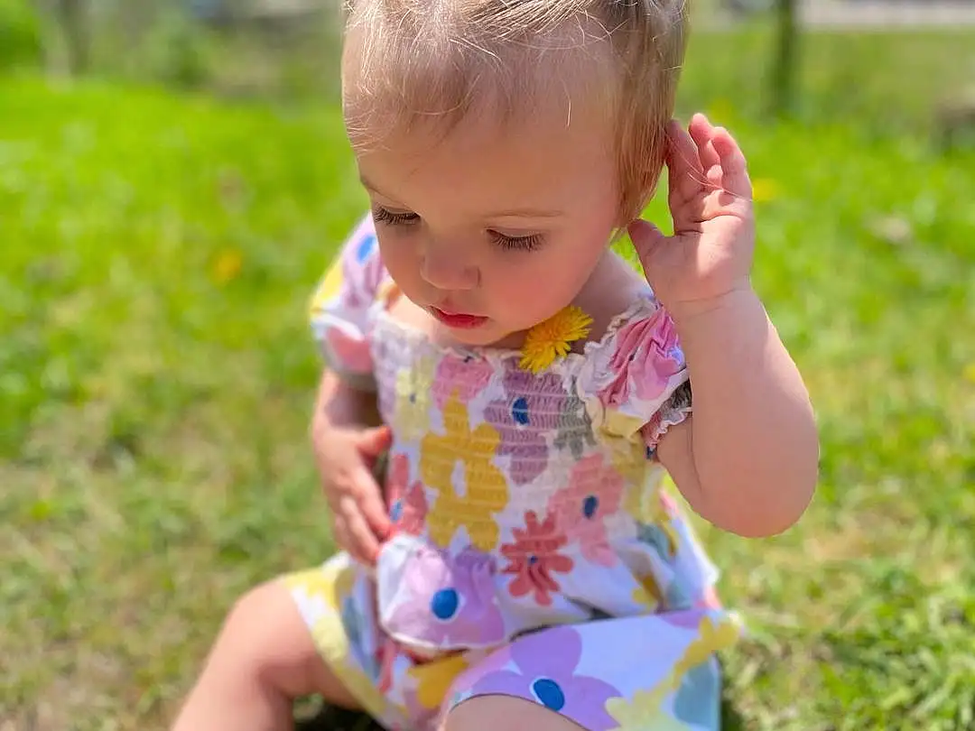 Face, Skin, Photograph, Plant, People In Nature, Baby & Toddler Clothing, Dress, Happy, Grass, Sunlight, Pink, Toddler, Summer, Child, Fun, Meadow, Leisure, Barefoot, Thigh, Person