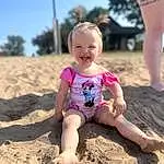 Smile, Leg, People In Nature, People On Beach, Sky, Happy, Body Of Water, Fun, Beach, Toddler, Thigh, Leisure, Recreation, Sand, Human Leg, Landscape, Tree, Barefoot, Soil, Child, Person, Joy
