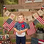 Photograph, White, Window, Shorts, Flag Of The United States, Smile, Flag, Red, Summer, People, Flag Day (usa), Event, Holiday, Grass, Recreation, Pattern, Child, Toddler, T-shirt, Plaid, Person, Joy