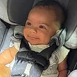 Nose, Cheek, Skin, Eyebrow, Facial Expression, Comfort, Iris, Smile, Seat Belt, Finger, Cool, Baby, Car Seat, Baby & Toddler Clothing, Toddler, Happy, Thumb, Head Restraint, Auto Part, Baby Carriage, Person