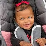 Cheek, Skin, Smile, Lip, Outerwear, Photograph, Facial Expression, Black, Iris, Pink, Happy, Baby & Toddler Clothing, Toddler, Comfort, Red, Child, People, Baby, Beauty, Person, Joy