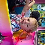 Photograph, Vroom Vroom, Mode Of Transport, Smile, Fun, Toddler, Leisure, Recreation, Vehicle, Child, Vehicle Door, T-shirt, Art, Magenta, Machine, Games, Automotive Exterior, Play, Communication Device, Person, Sorrow