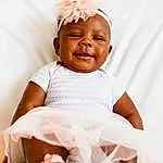 Face, Head, Smile, Arm, Baby & Toddler Clothing, Sleeve, Happy, Flash Photography, Gesture, Baby, Comfort, Toddler, Peach, Thumb, Event, Child, Fashion Accessory, Magenta, Linens, Portrait Photography, Person, Joy