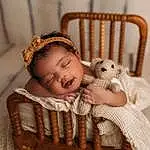 Skin, Furniture, Chair, Comfort, Wood, Baby & Toddler Clothing, Baby, Toy, Fawn, Toddler, Child, Happy, Sitting, Hardwood, Furry friends, Doll, Room, Linens, Person