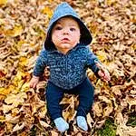 Face, People In Nature, Natural Environment, Grass, Sunlight, Yellow, Tree, Plant, Deciduous, Baby & Toddler Clothing, Woody Plant, Toddler, Wood, Tints And Shades, Baby, Child, Happy, Soil, Sitting, Landscape, Person, Headwear