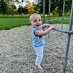 Plant, Smile, People In Nature, Nature, Tree, Botany, Standing, Grass, Happy, Toddler, Baby, Baby & Toddler Clothing, Fun, Leisure, Recreation, T-shirt, Fence, Child, City, Playground, Person, Joy