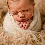 Nose, Glasses, Cheek, Skin, Lip, Comfort, Human Body, Smile, Neck, Sleeve, Happy, Baby, Gesture, Wood, Toddler, Baby & Toddler Clothing, Close-up, Grass, Child, Furry friends, Person, Joy